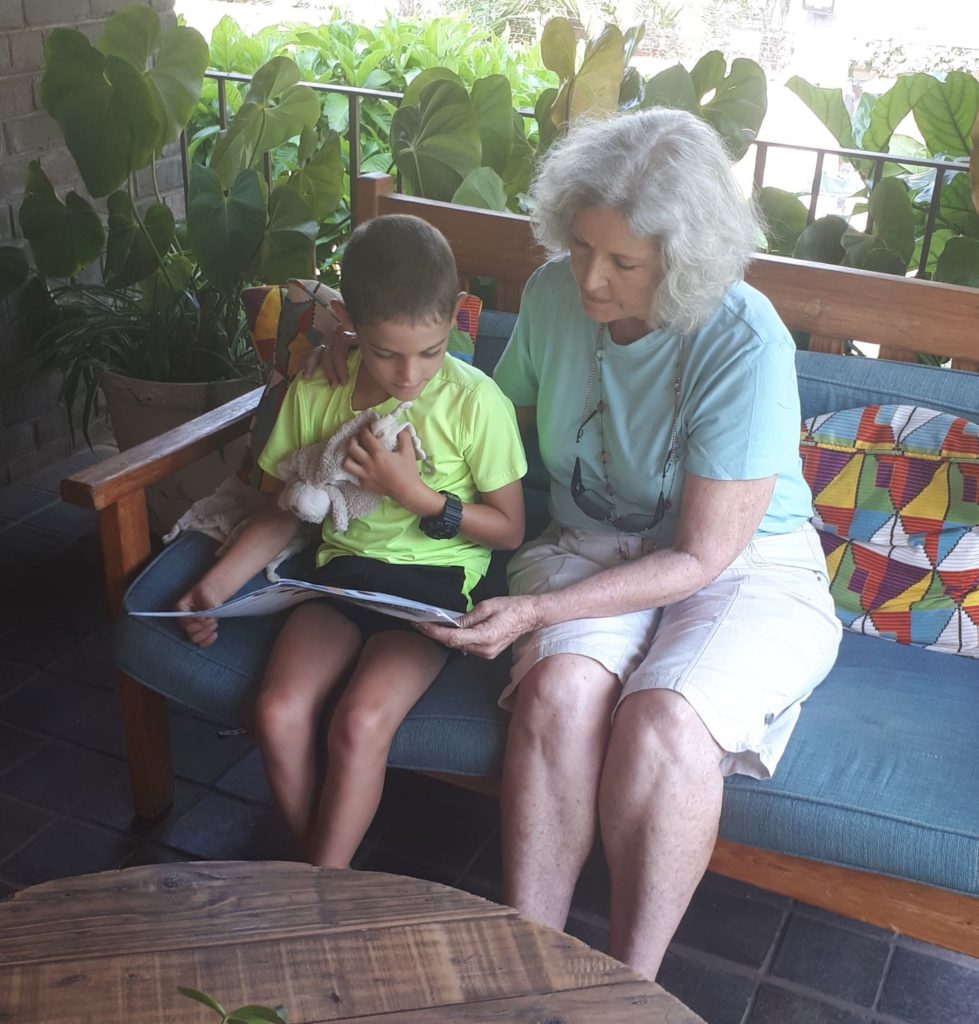 reading with his granny.