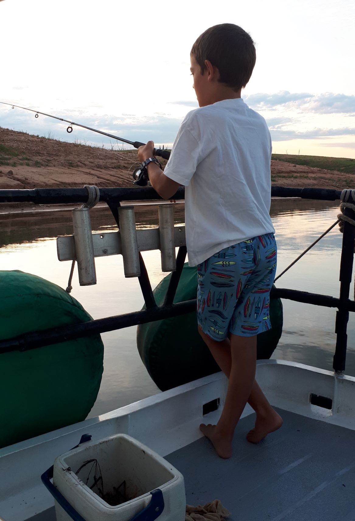 Murray John fishing off the houseboat.