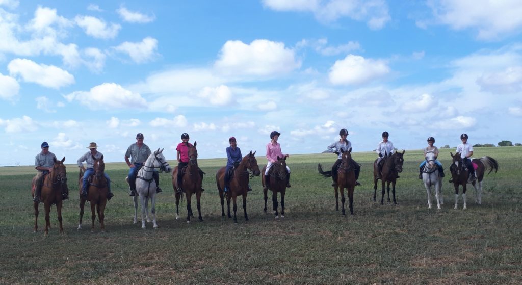 Activity 10 horses off  for a ride. 