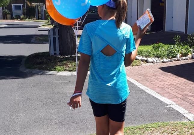 Paula Joy celebrating with ballons.