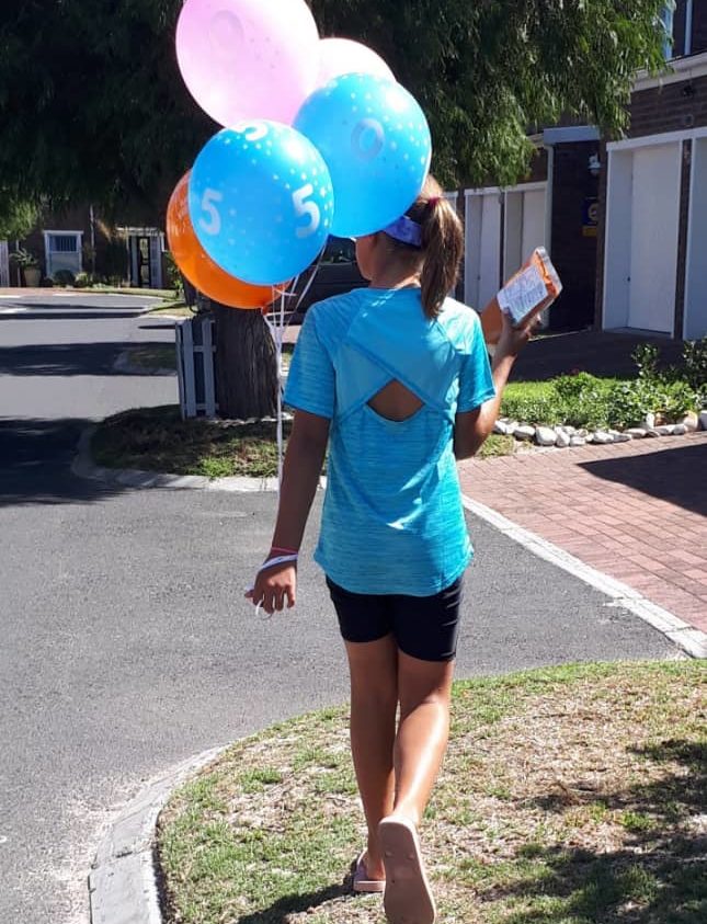 Paula Joy celebrating with ballons.