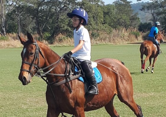 Murray John playing polo on Silver.