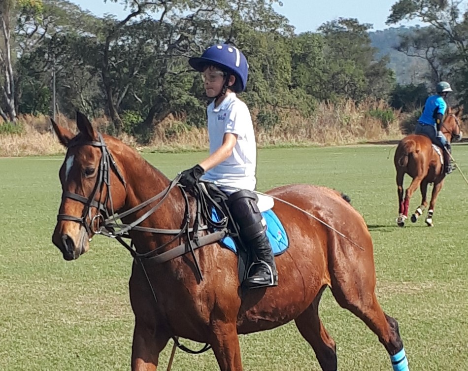 Murray John playing polo on Silver.