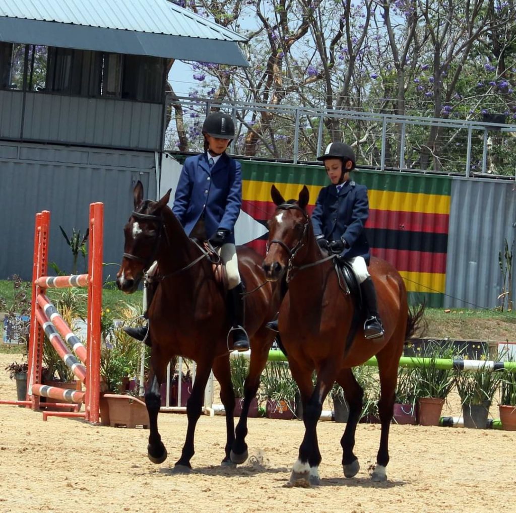 Children ready for their showing class on their horses. 