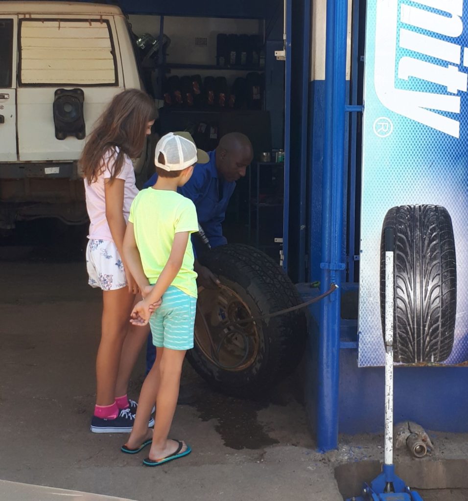 watching the tire being repaired. 