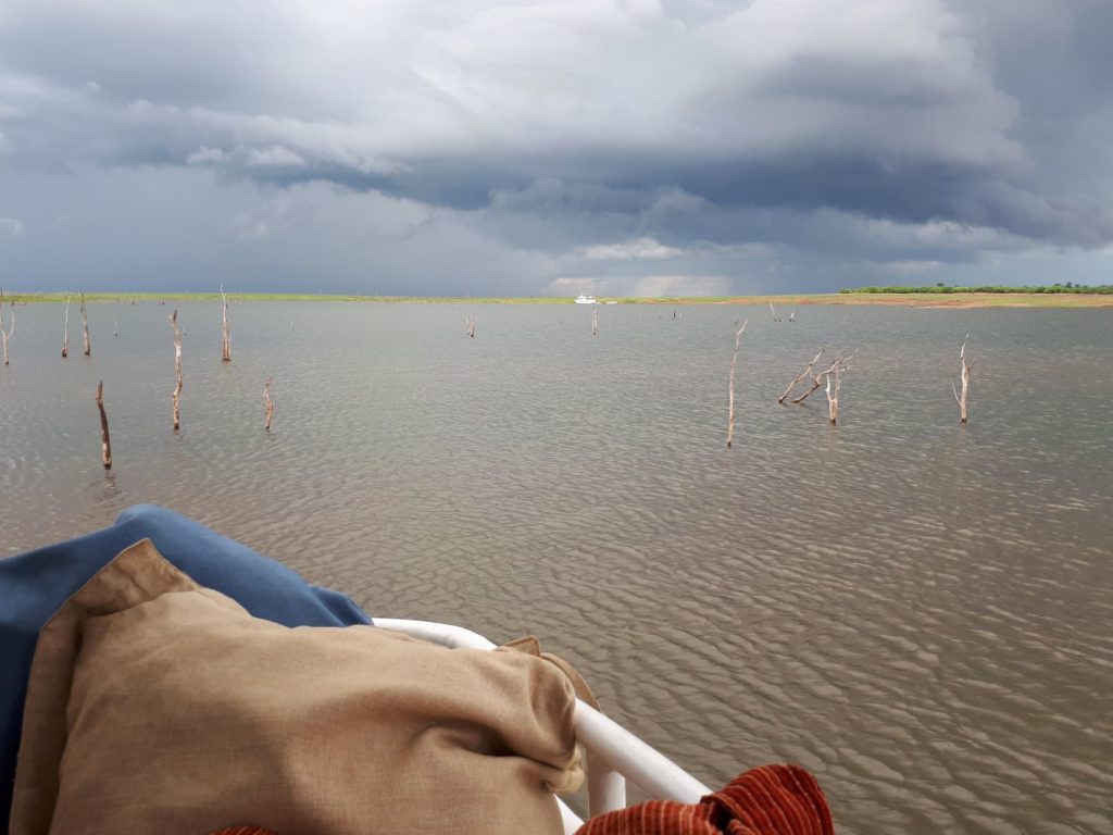 Watching the storm in the distance from the houseboat. 