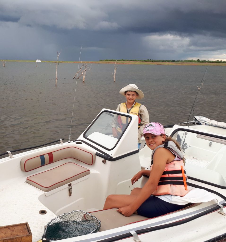 Adventure kids driving the boat on Kariba. 