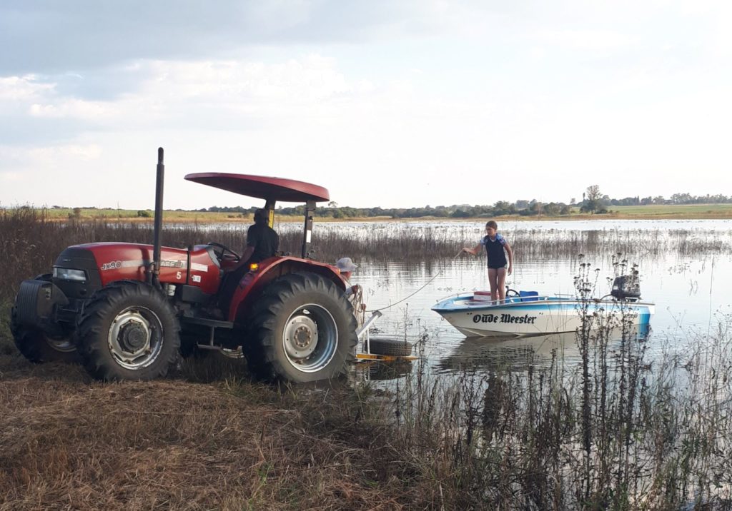 launching the boat on the farm dam. 