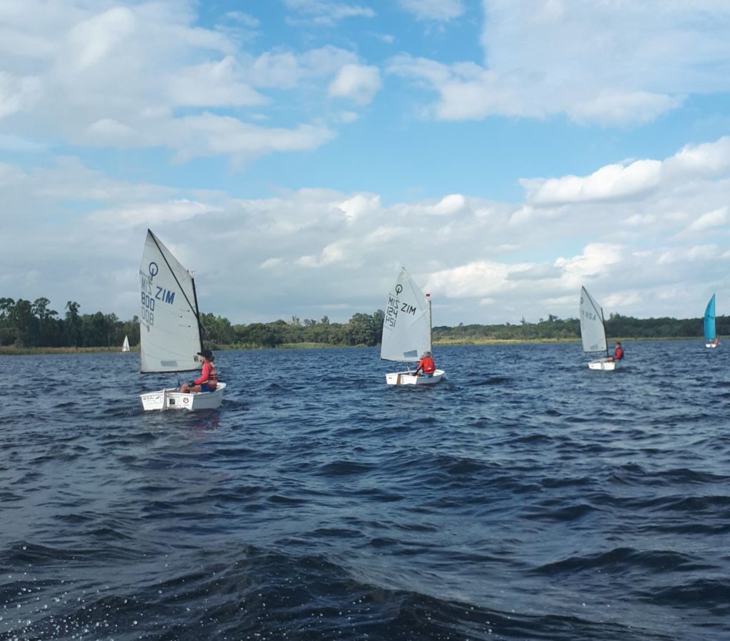 Kids sailing a course. 