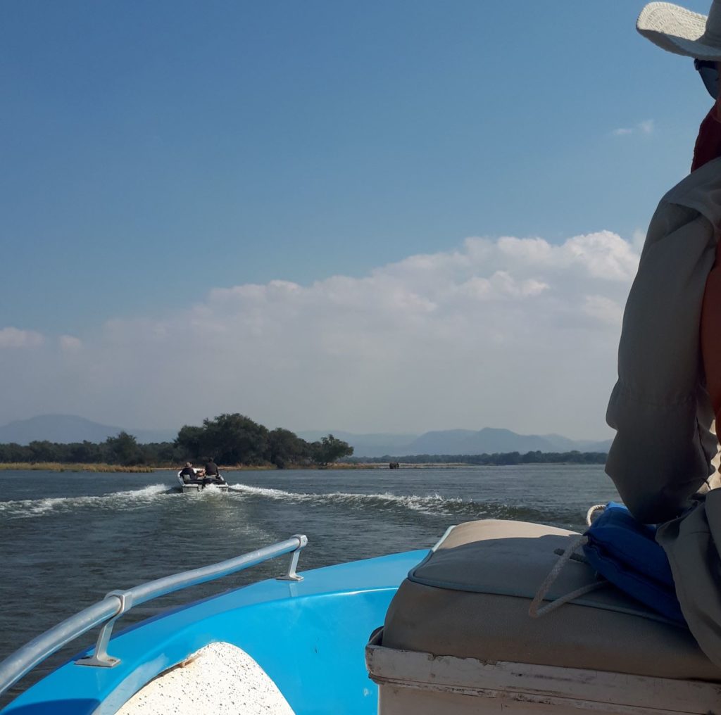 Boats traveling up the Zambezi river to Chikwenya Isaland. 