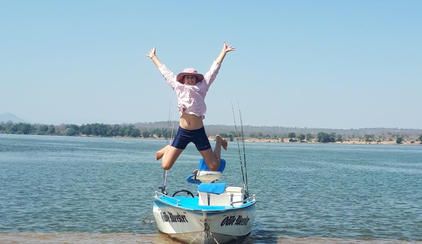 zambezi river adventures boat and happy girl.