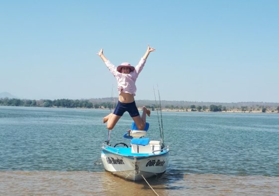 zambezi river adventures boat and happy girl.