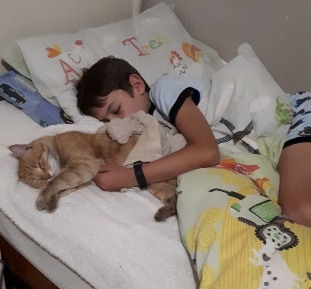 Murray John sleeping with his cat. 