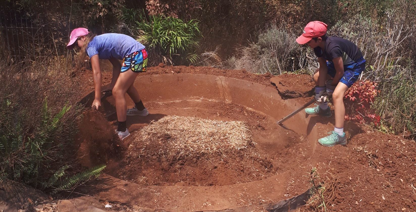 kids activity digging out a pond.