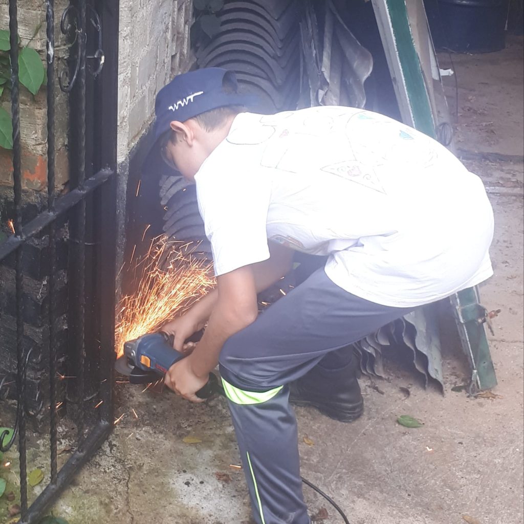 kid activity learning to use the angle grinder. 