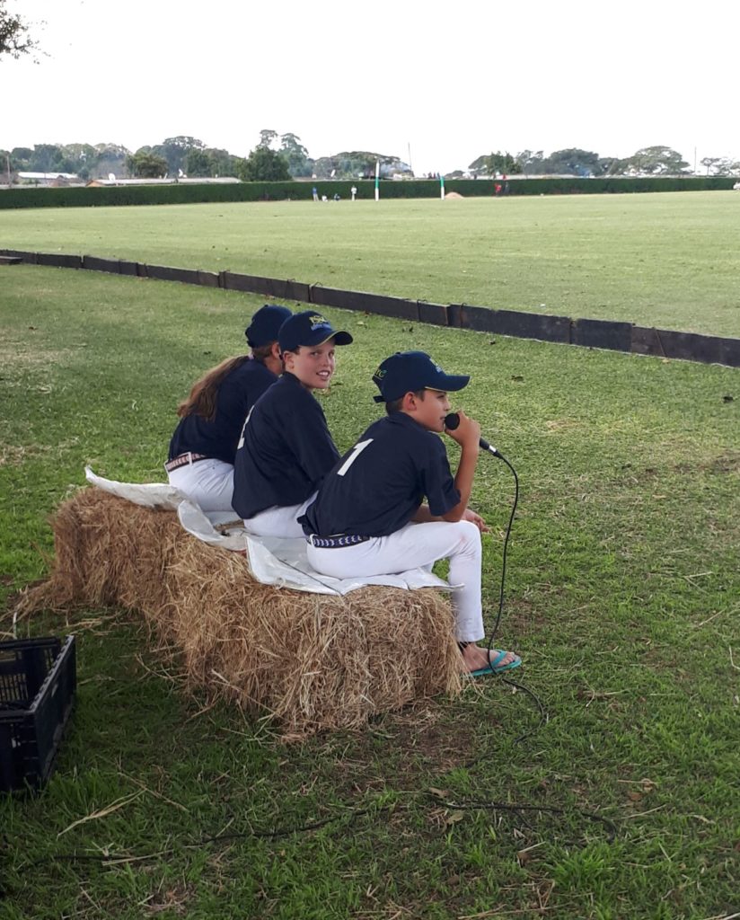 kids commentating at polo.