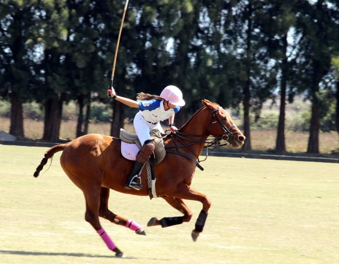 Paula Joy playing polo