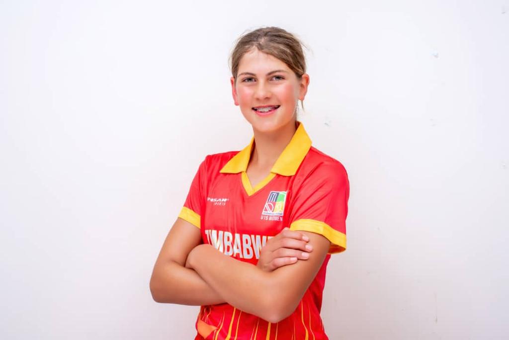Paula Joy Whaley in team cricket uniform.