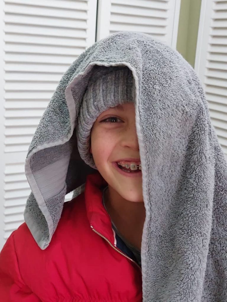 Child's individuality and talents.   Murray John with a towel over half his head.