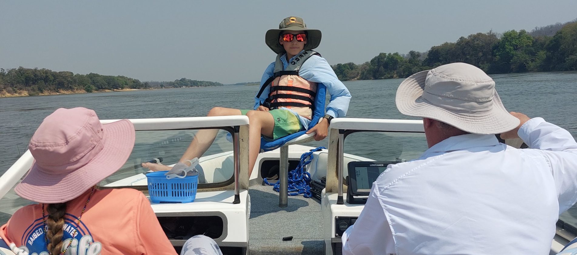 family boating on the Zambezi River.