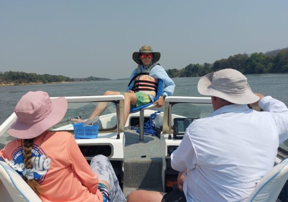 family boating on the Zambezi River.