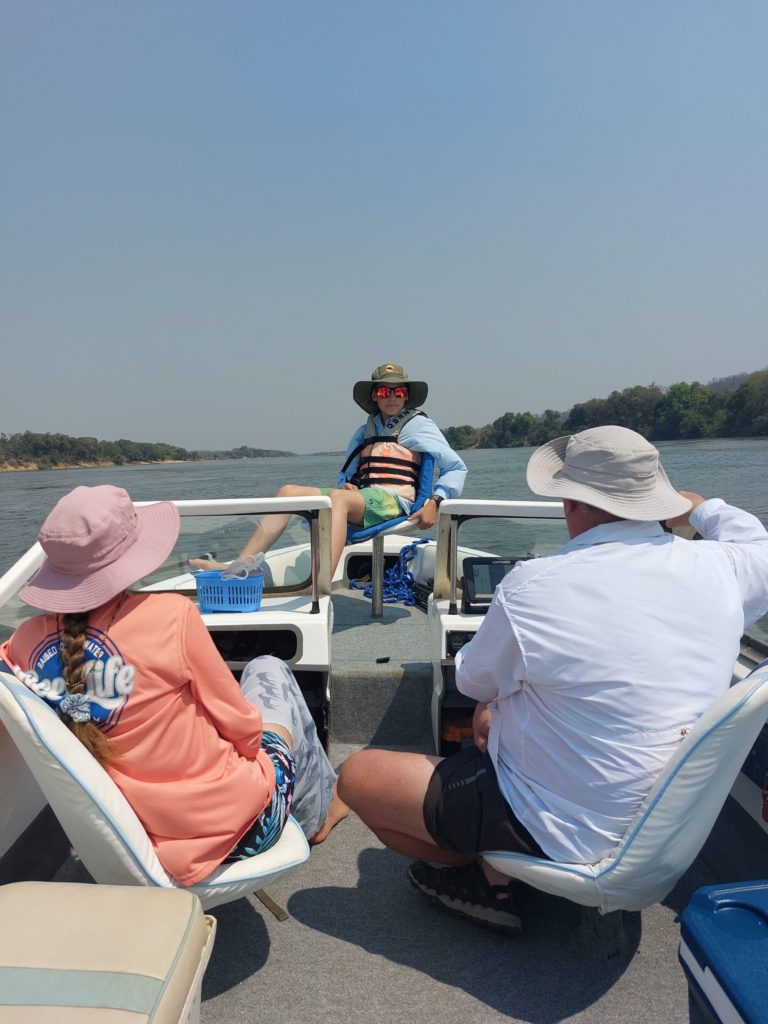 family boating on the Zambezi River.