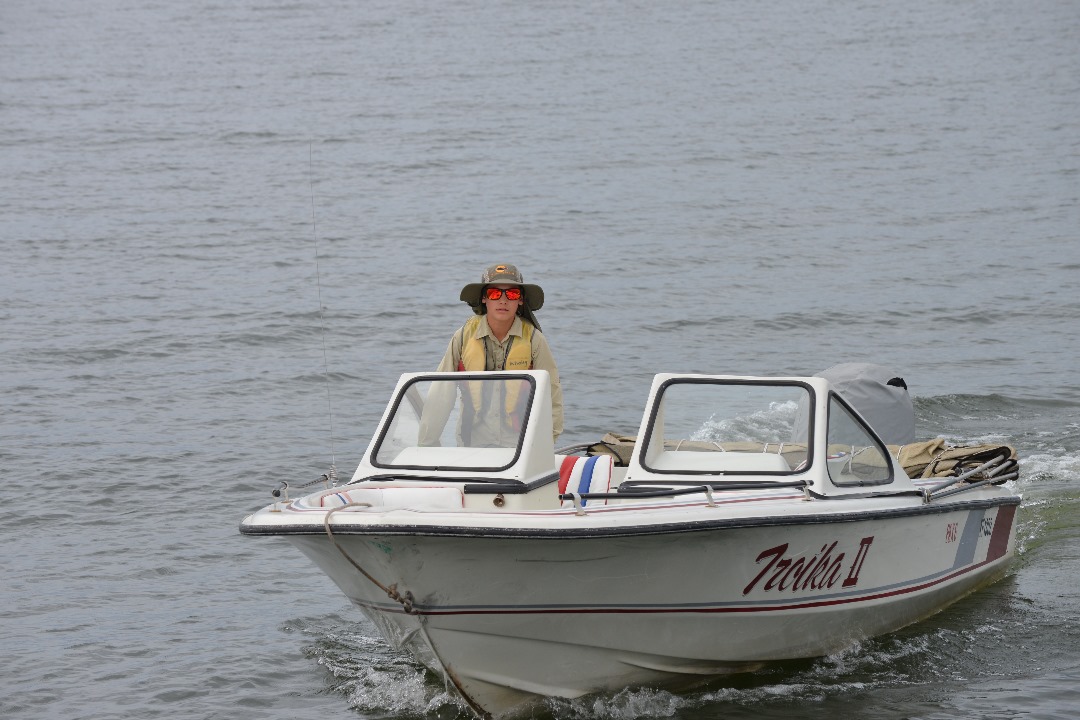 boy driving speed boat