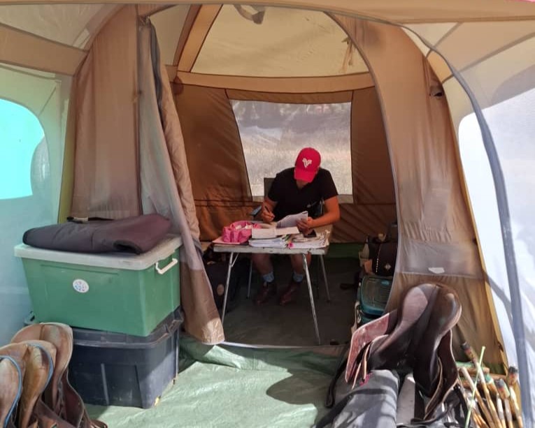 Our homeschooling Activity. Doing school in the tack room tent. 